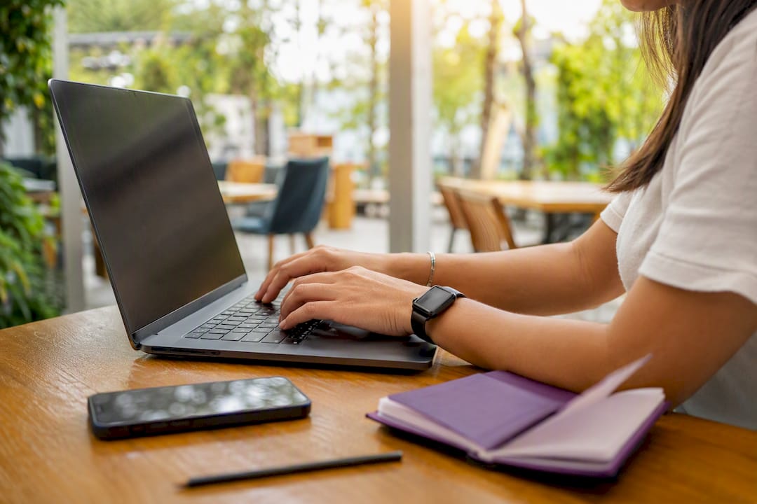 Hands entering business citations manually