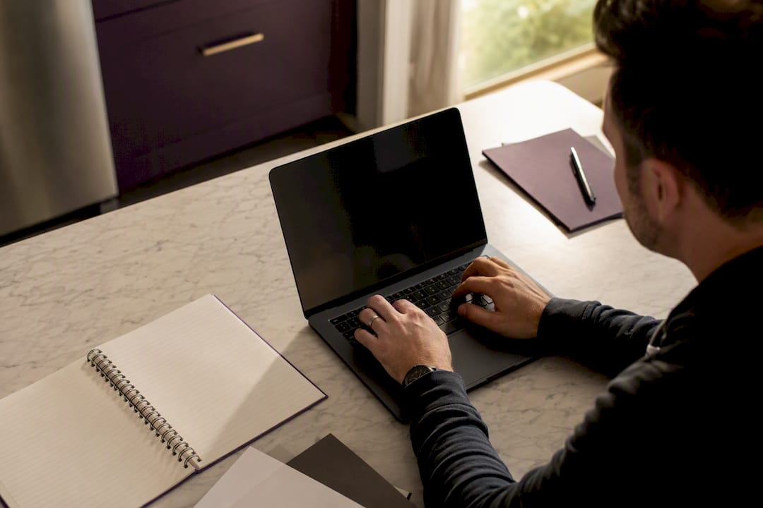 Hands selecting Google categories on laptop
