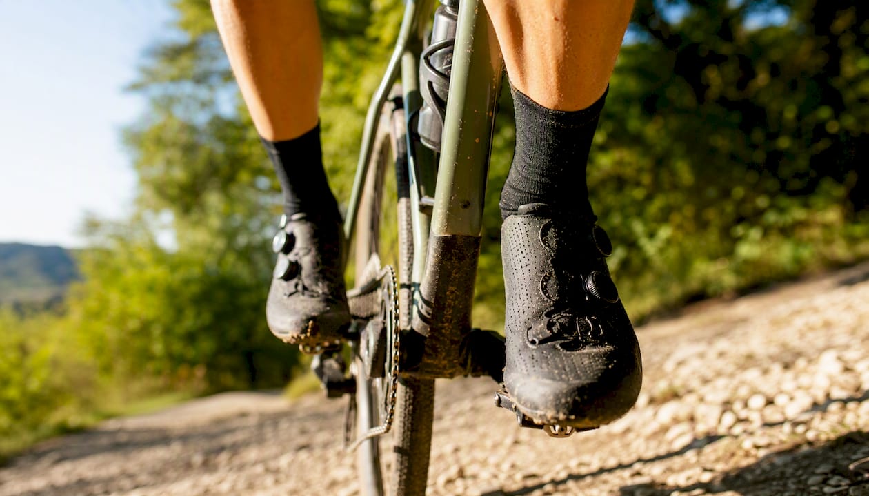 Cyclist pedaling with knees pushed outward