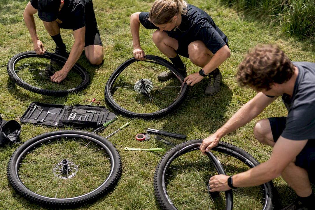 Cyclists fitting tires for various riding disciplines