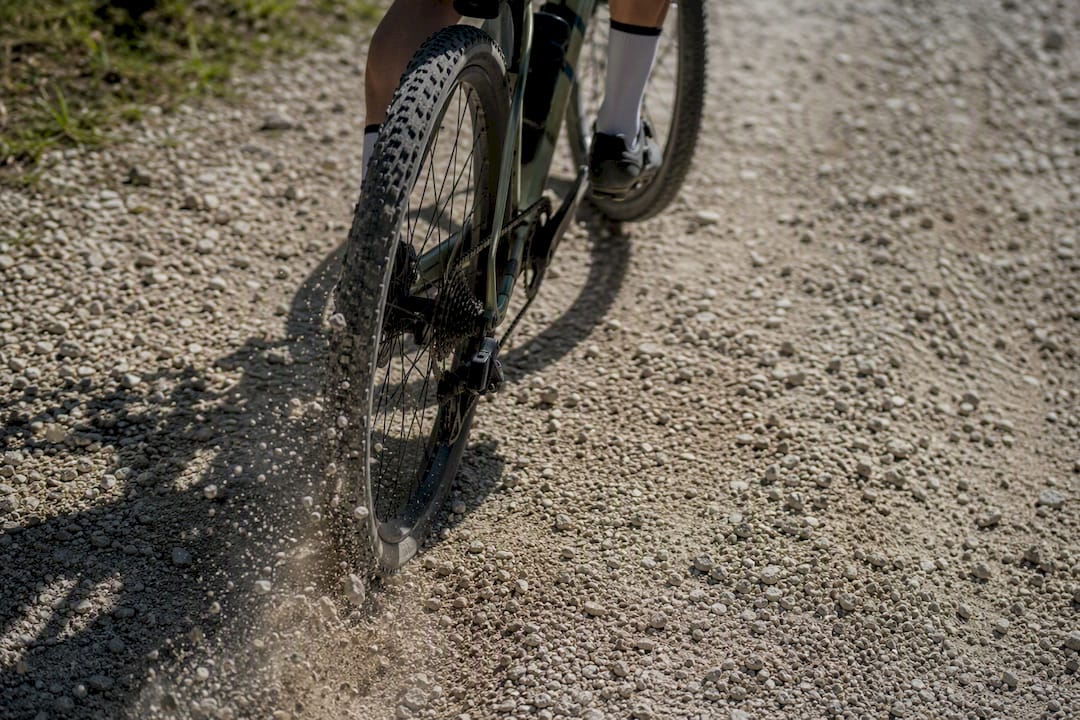 Gravel bike tires gripping loose gravel trail surface