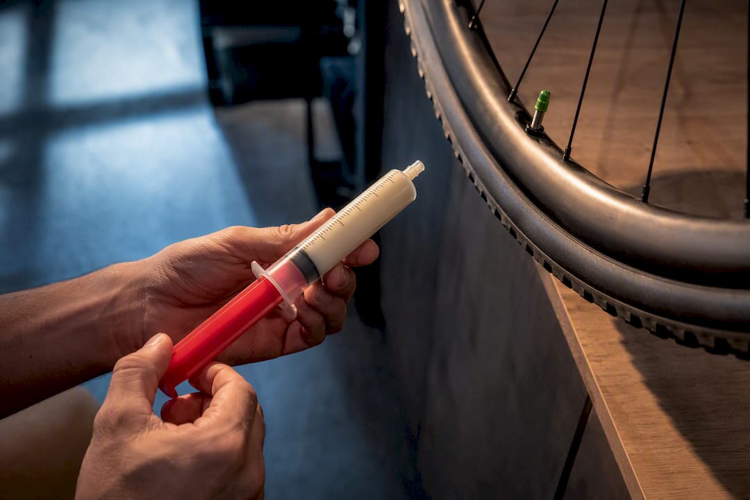 Mechanic measuring tubeless tire sealant