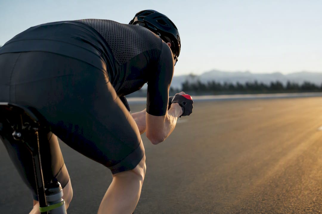 Cyclist testing a tucked bottle placement