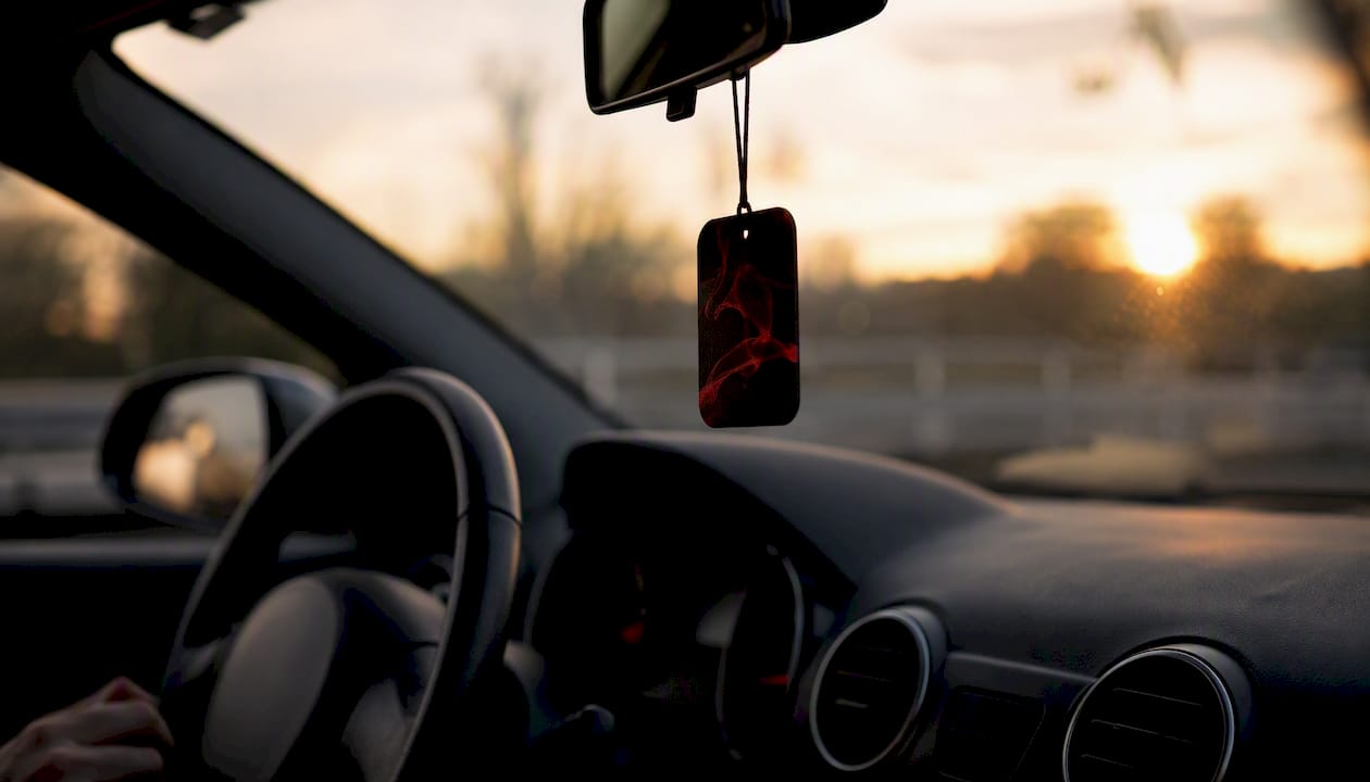 Cardboard air freshener hanging in car interior