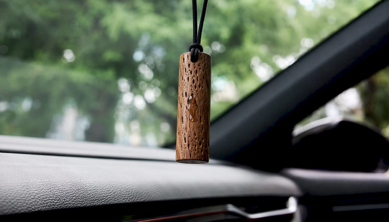 Wooden scent hanger releasing fragrance