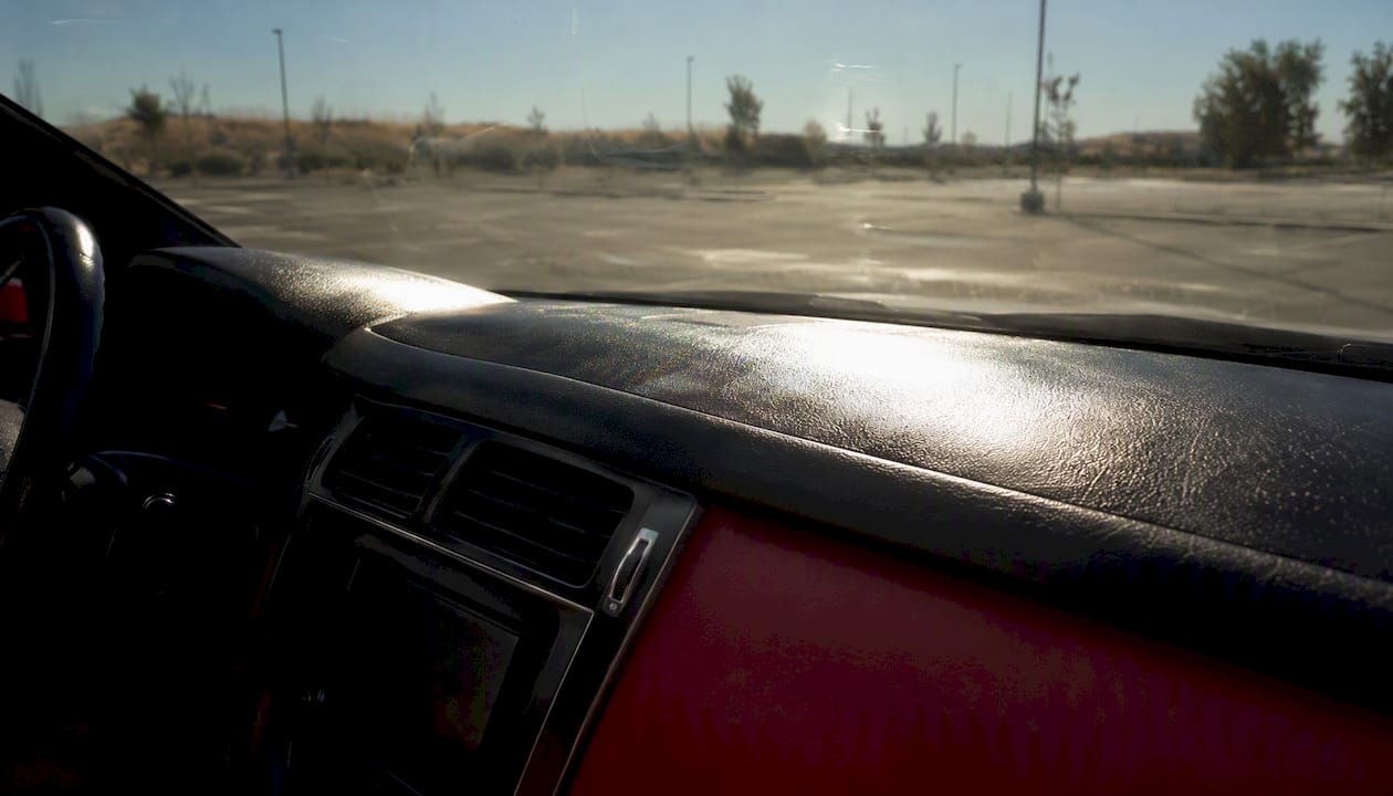 Sun-heated car dashboard in bright light