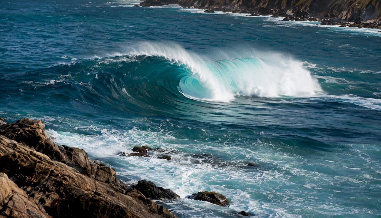 Plunging breaker barrel wave on steep shore slope