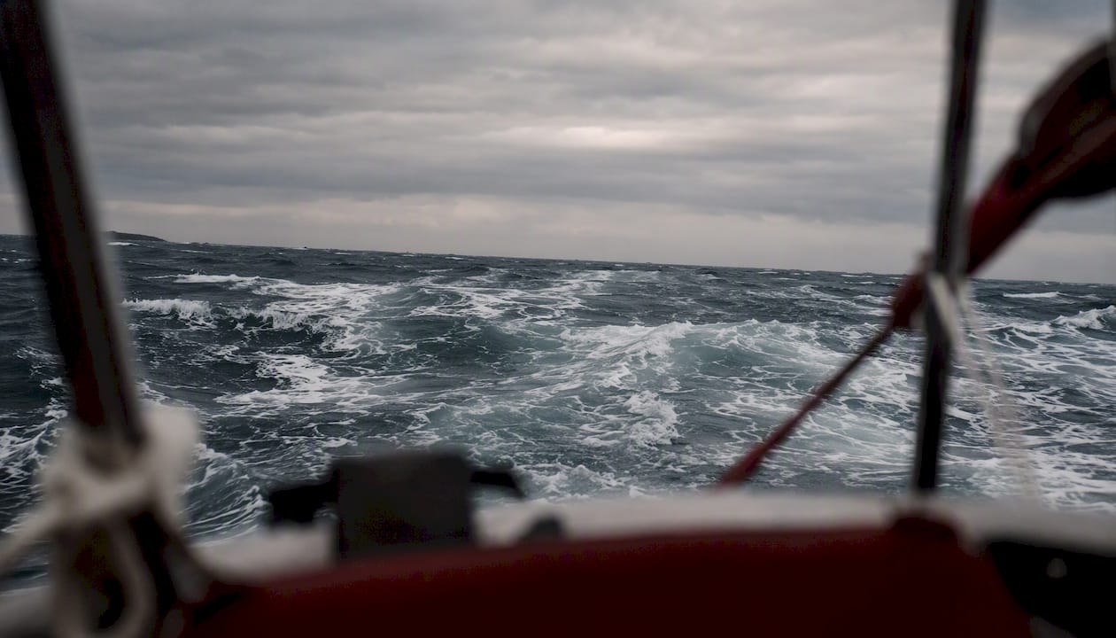 Sailing vessel bow view over mixed sea state