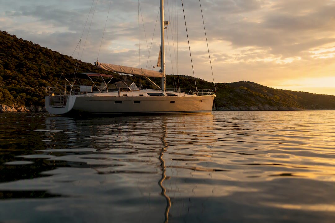Sailboat rolling at anchor in swell