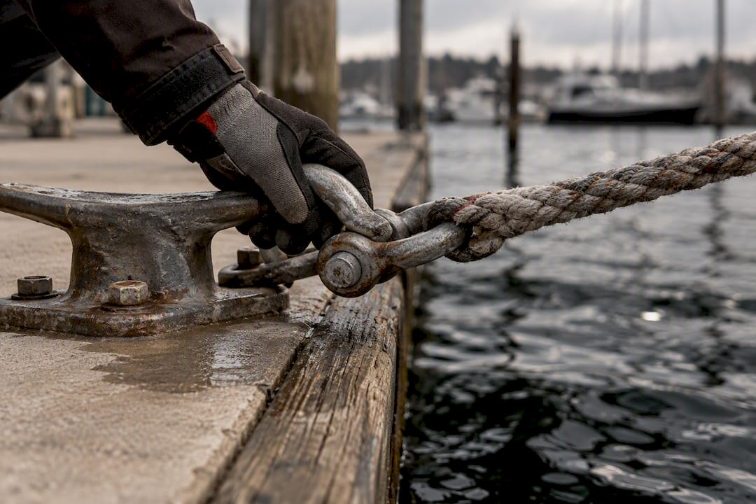Weathered mooring chain being inspected