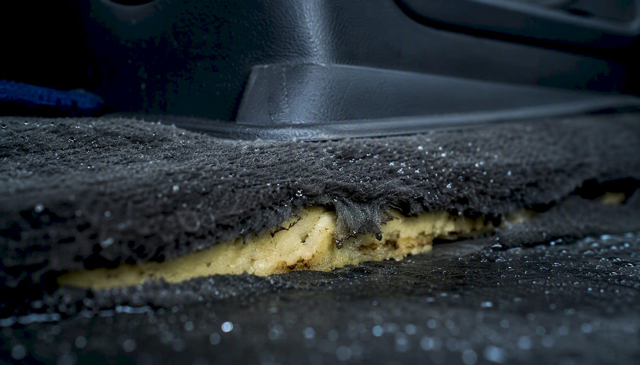 Close-up of car carpet and foam padding layers