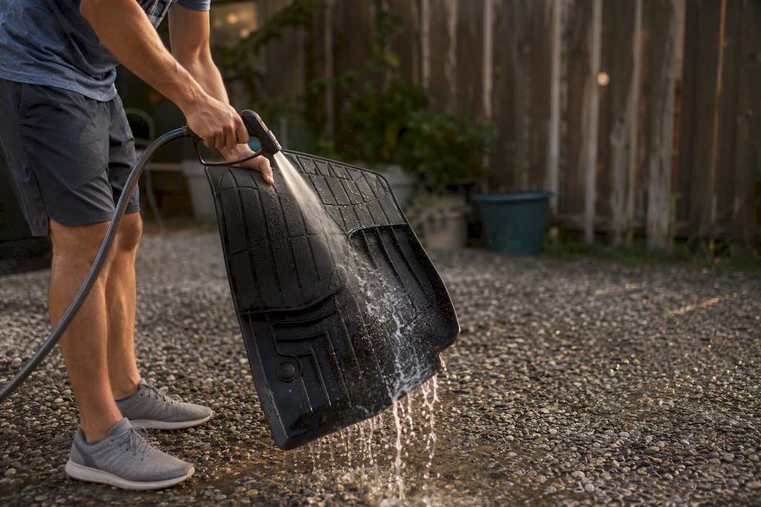 Rinsing TPE floor mat with garden hose
