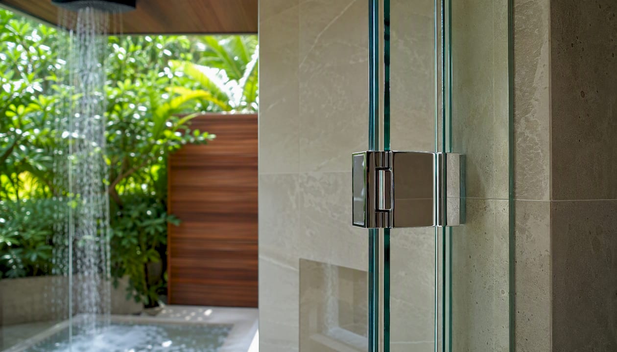 Frameless glass shower door hinge detail