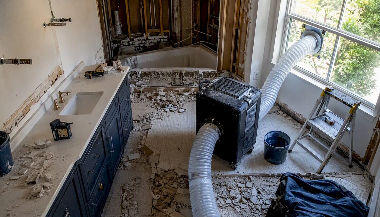 HEPA air scrubber ducted to window during renovation