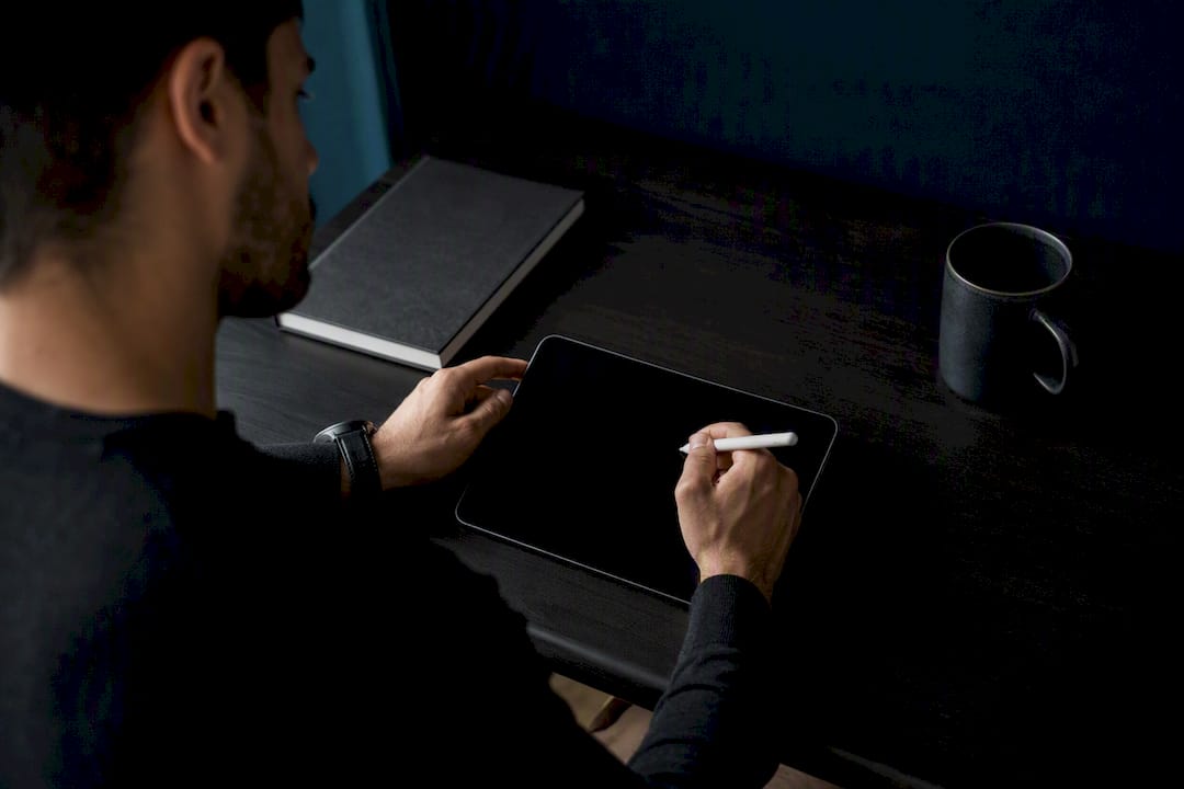 Hands verifying challenge terms on tablet