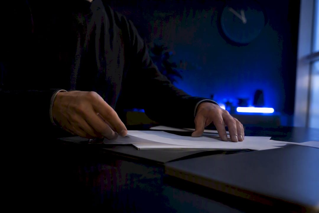 Trader's hands adjusting charts for account reset