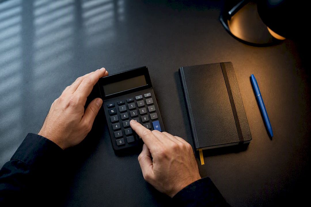 Trader calculating position risk at desk
