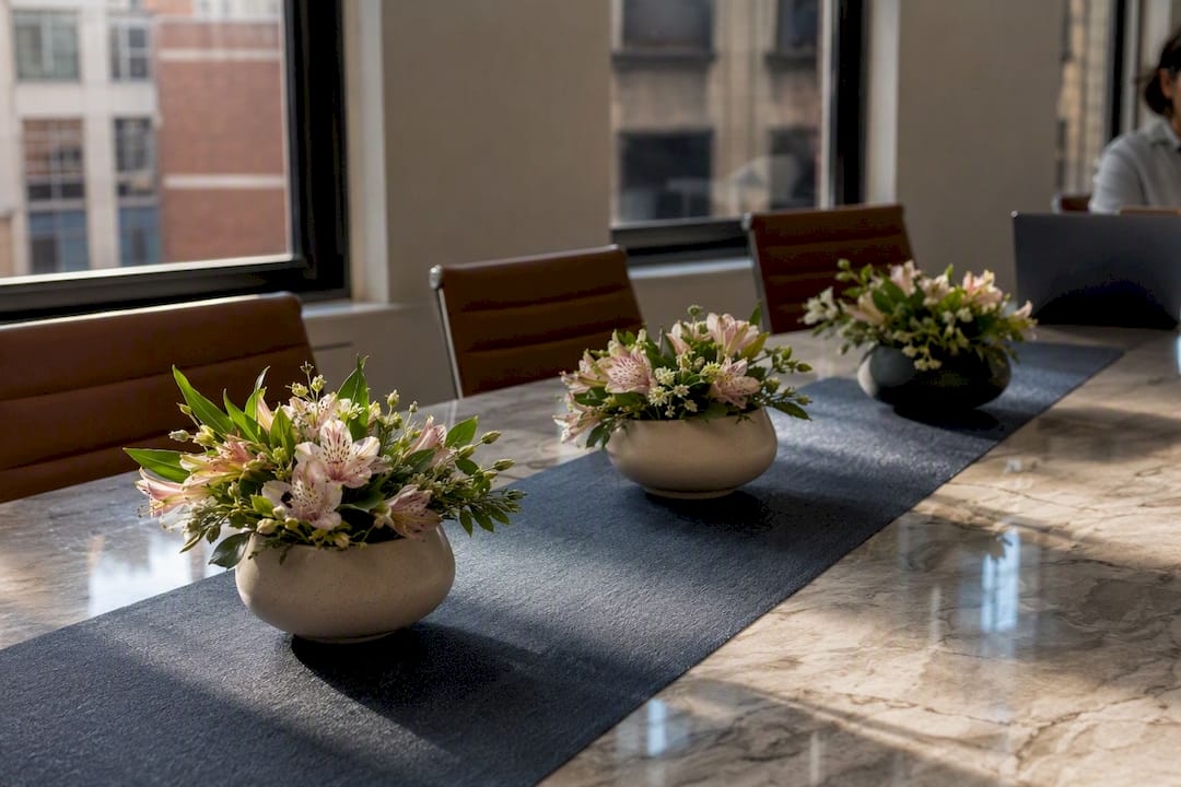 Low-profile flower arrangements on conference table