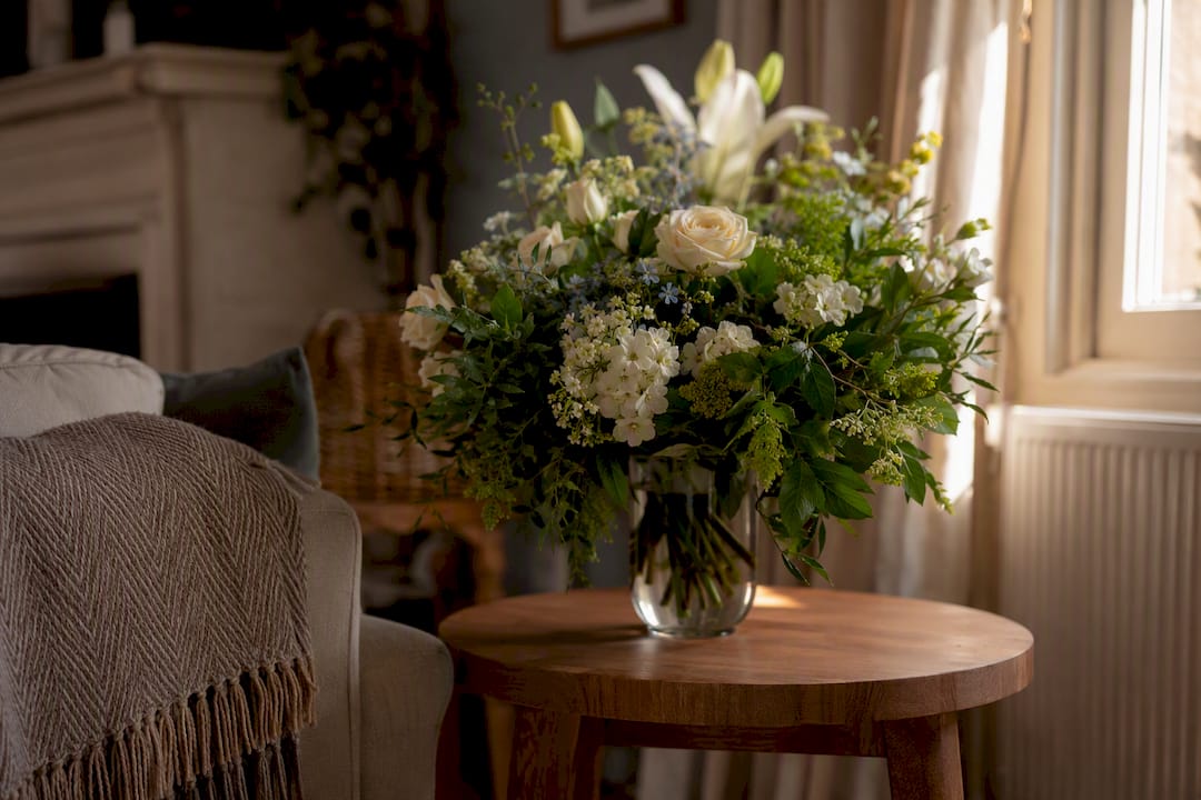 Sympathy flower arrangement in family home corner