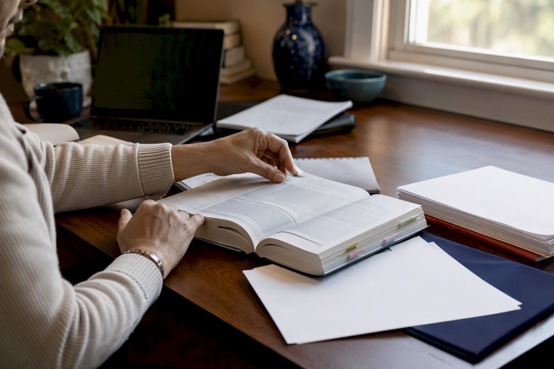 Immigration consultant hands managing files