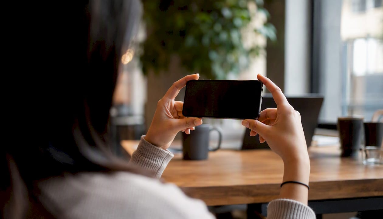 Hands recording casual user testimonial video