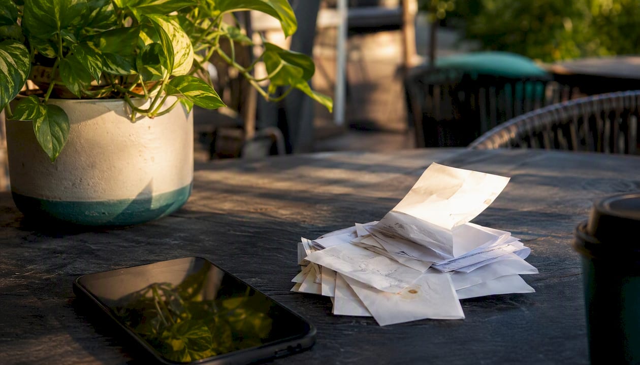 Workspace with receipts and digital tools for tax