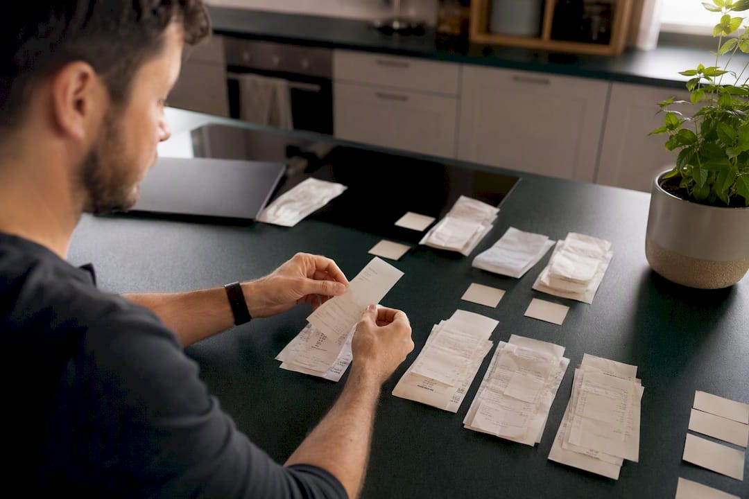 Hands scanning business receipts with smartphone