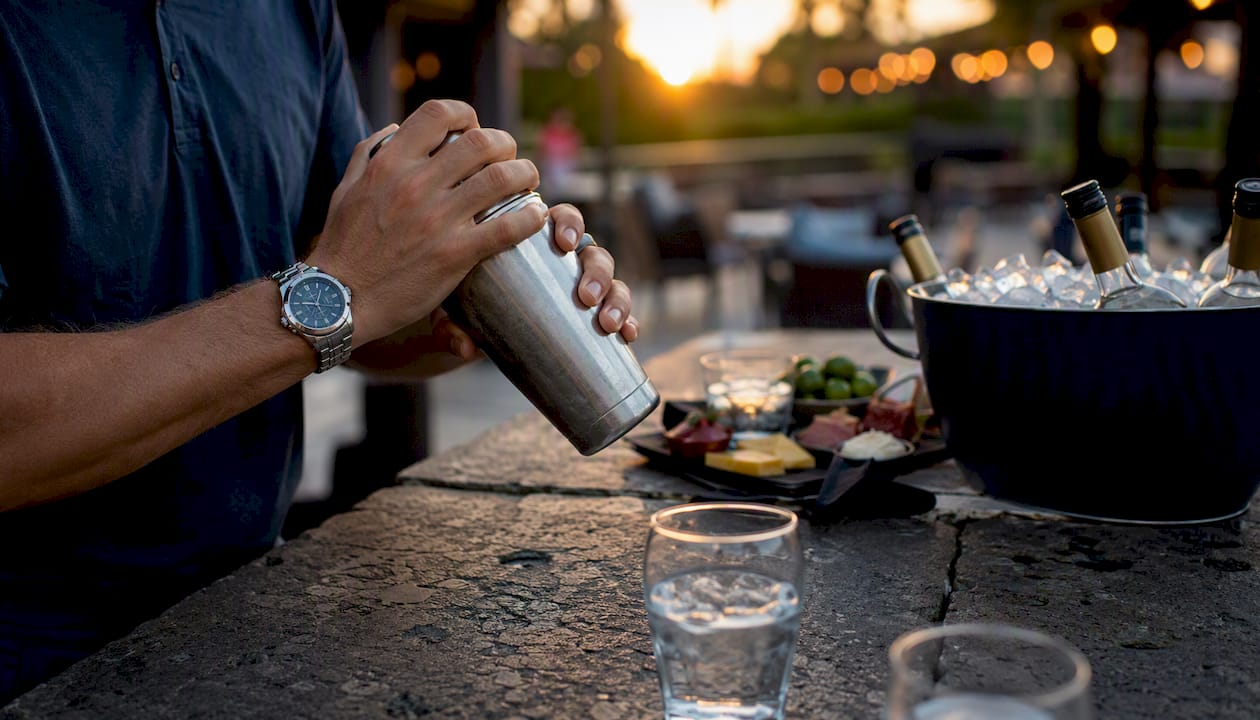 Pouring Broken Tee Vodka into cocktail glass