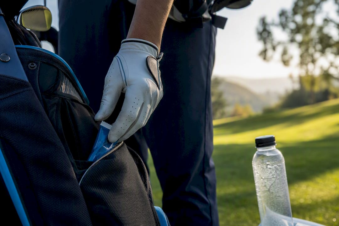 Electrolyte packets and water in golf bag pocket