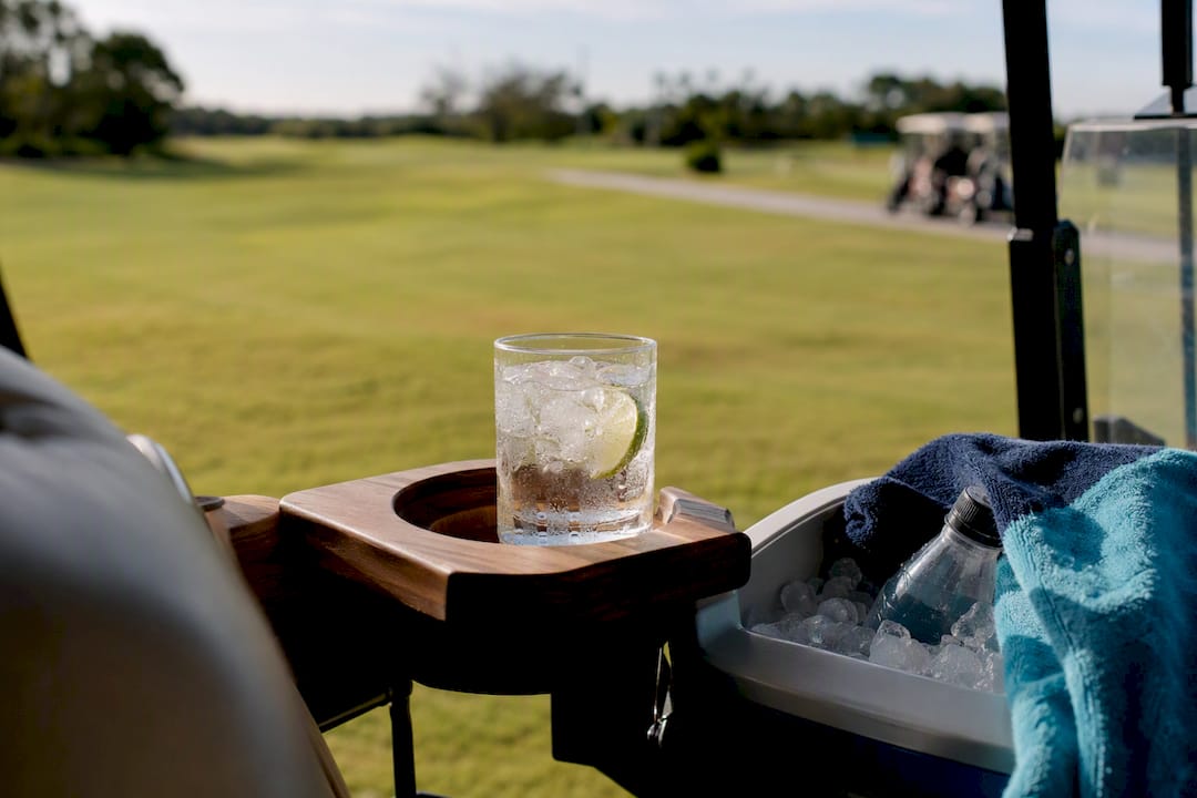 Low sugar mixed drink on golf cart holder