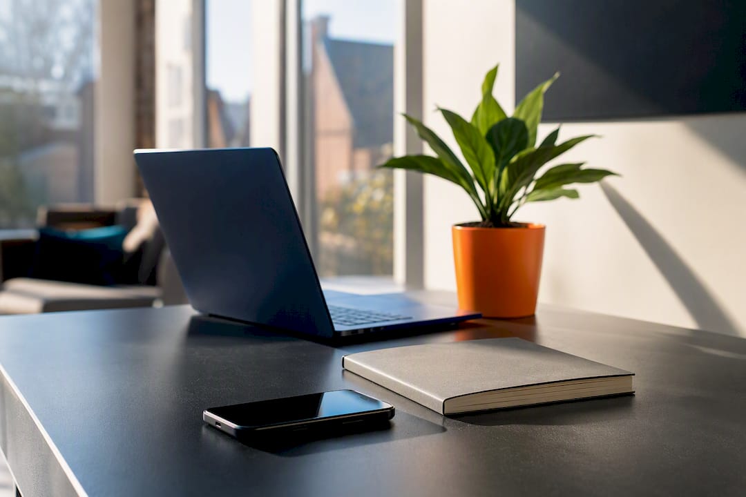 Smartphone and coffee mug on workspace table