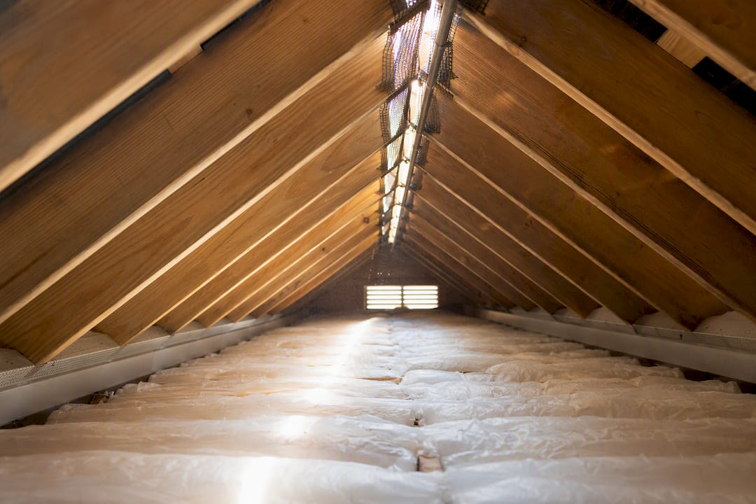 Attic showing soffit and ridge vent installation