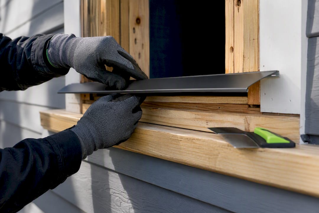 Drip cap installed above a window sill