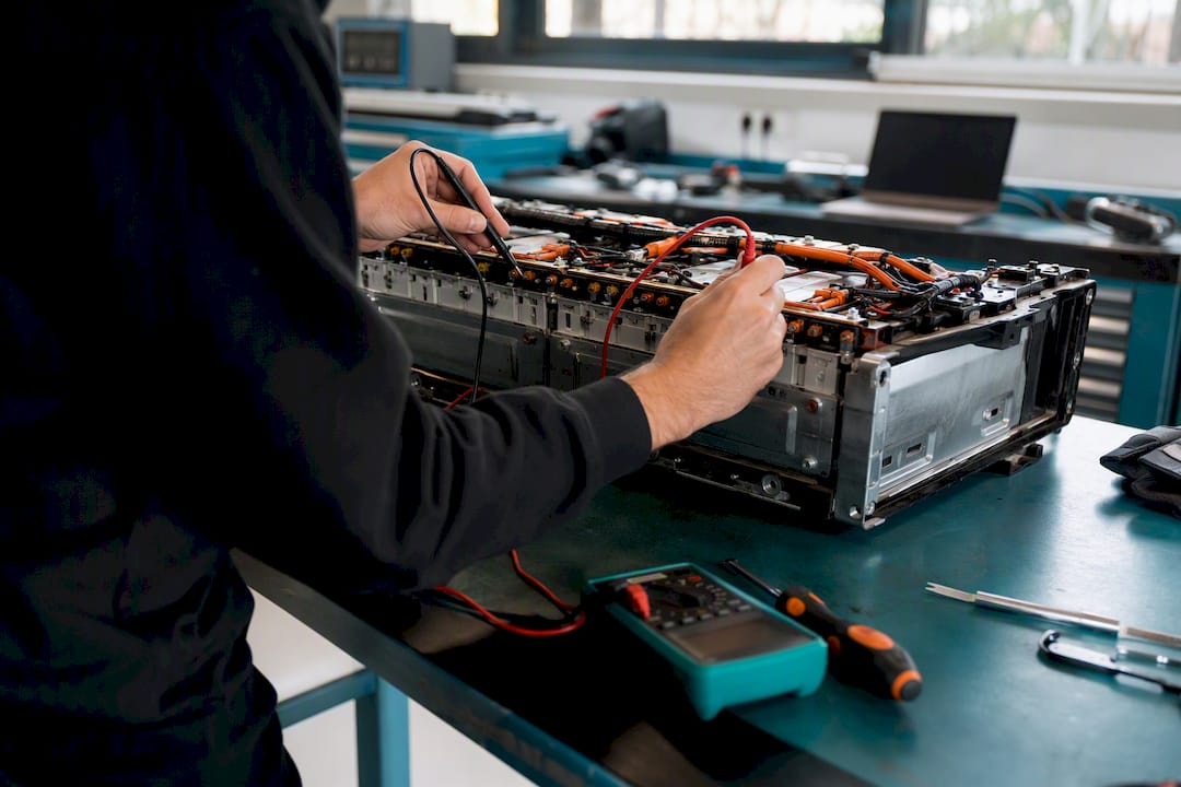 Technician inspecting EV battery pack module