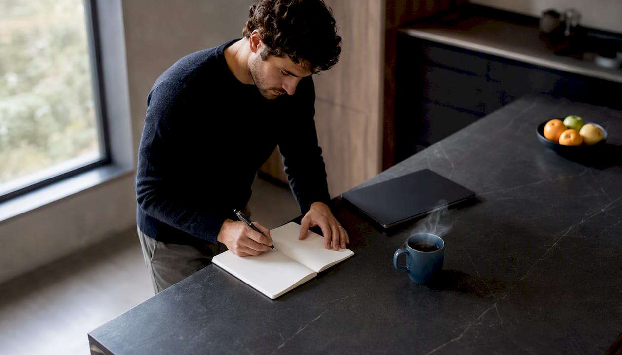 Candidate preparing behavioral interview answers at desk