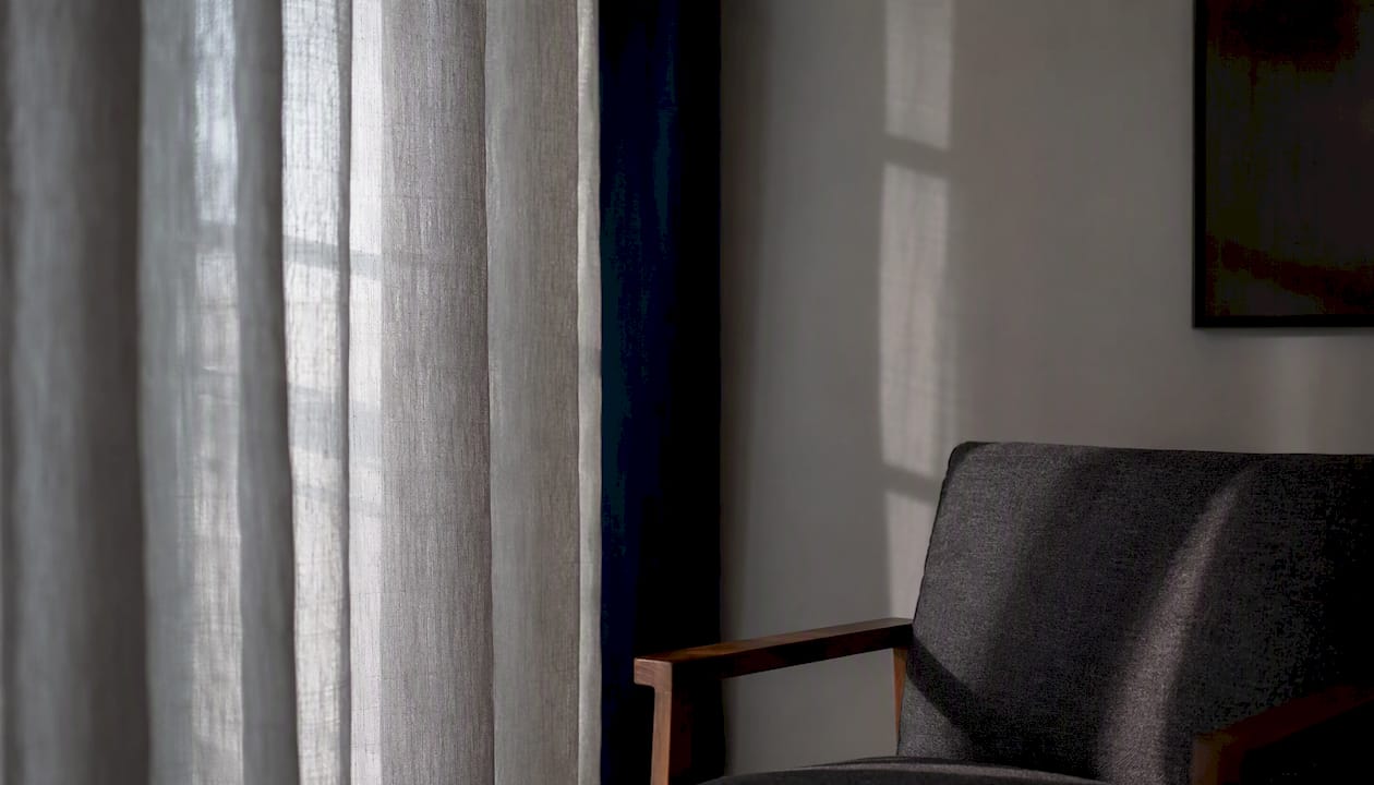 Soft daylight through sheer curtain window