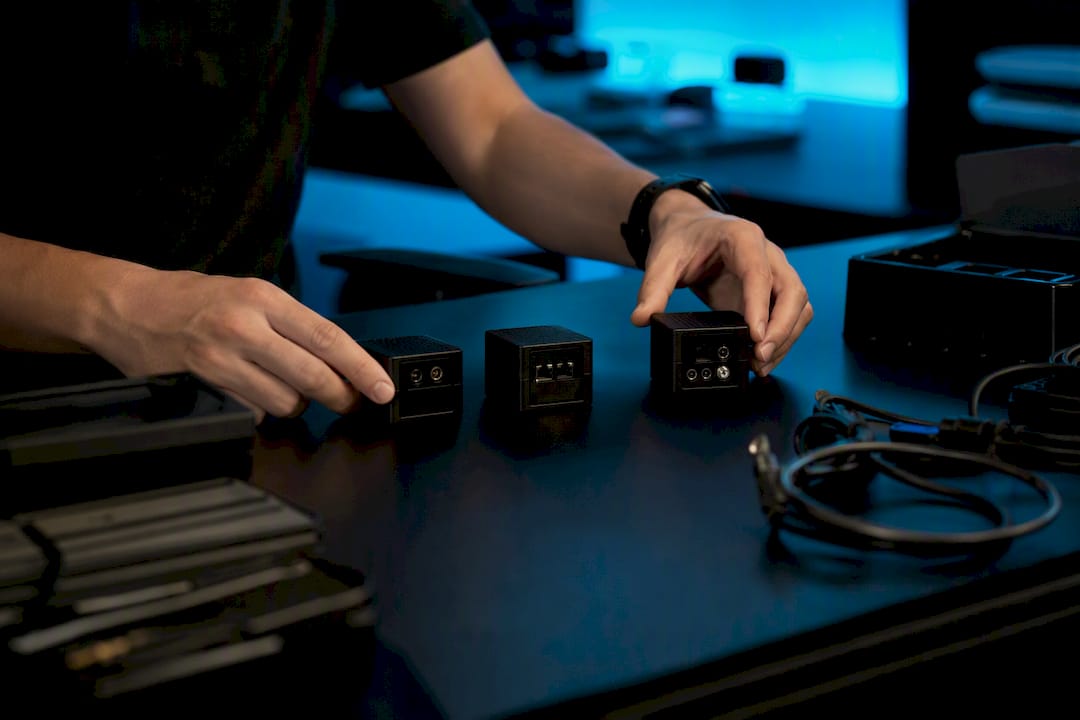 Hands organizing AI system modules