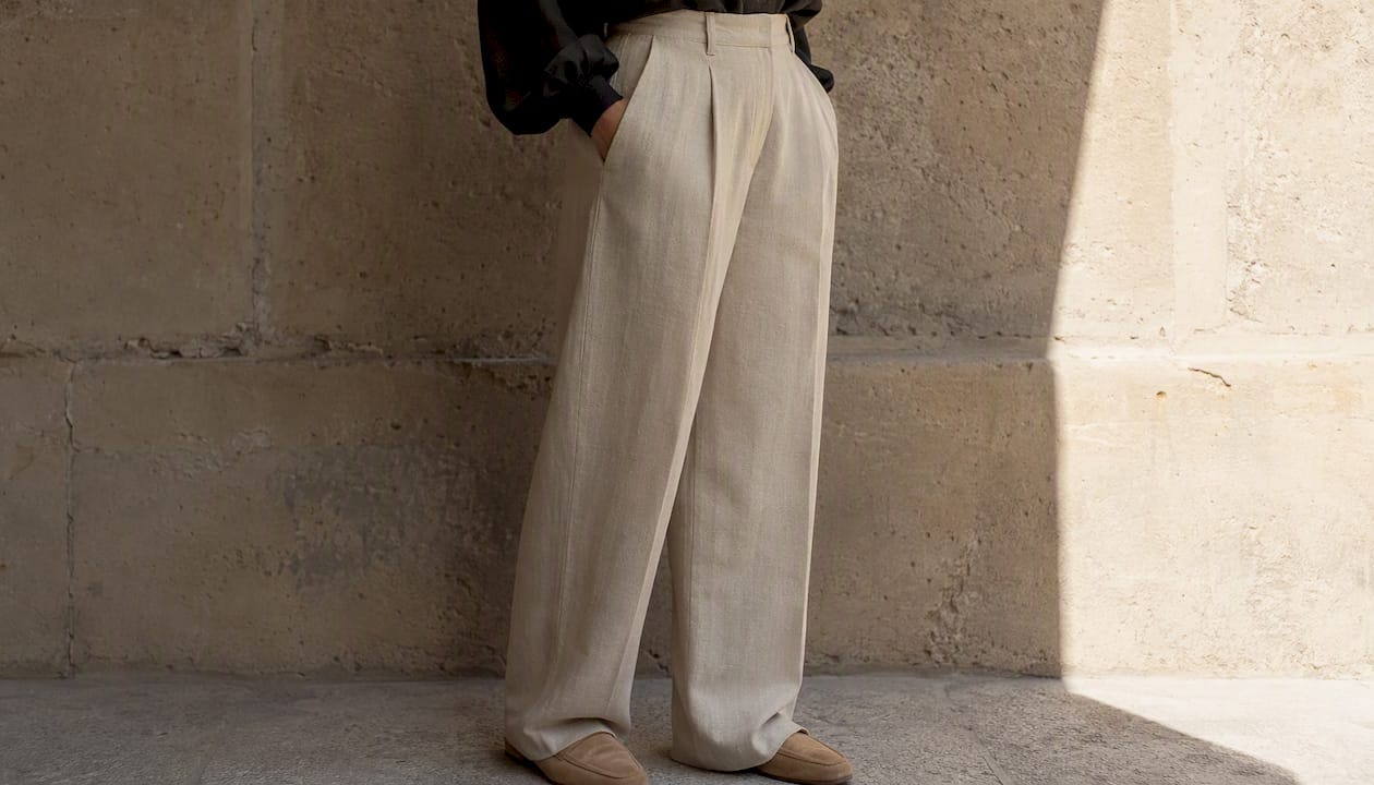 Close-up of tailored trousers and ankle boots