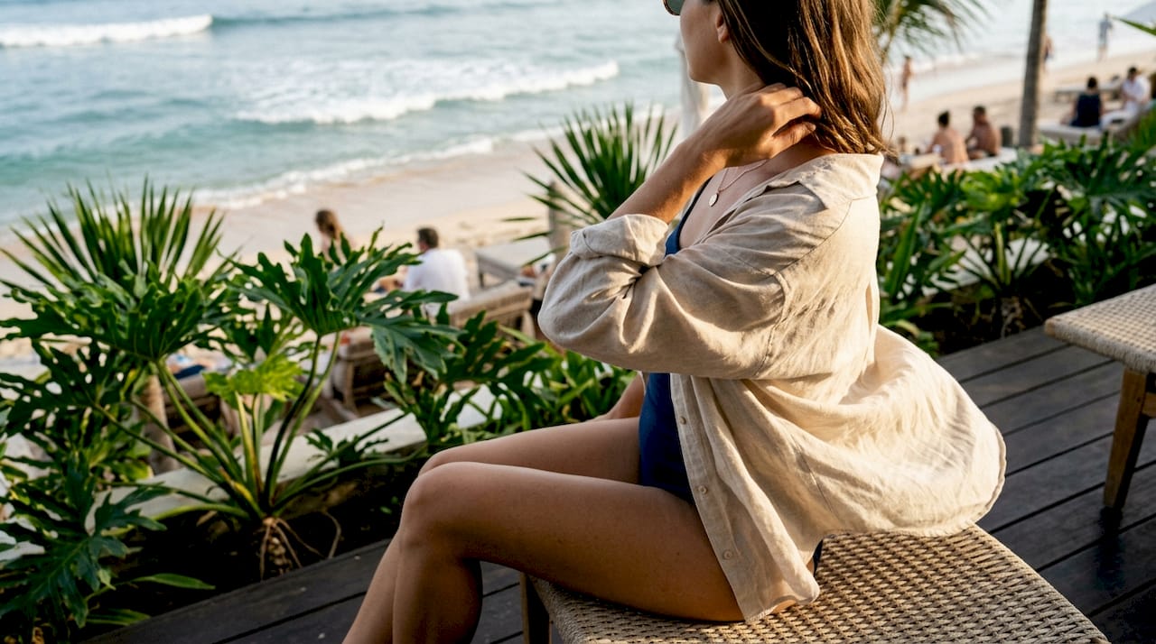 Open linen shirt over swimsuit beach look