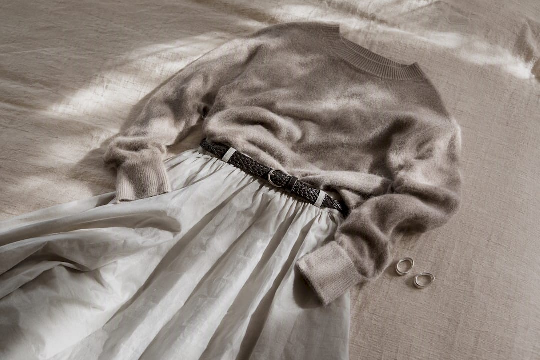 Monochrome fashion fabrics and accessories flat lay