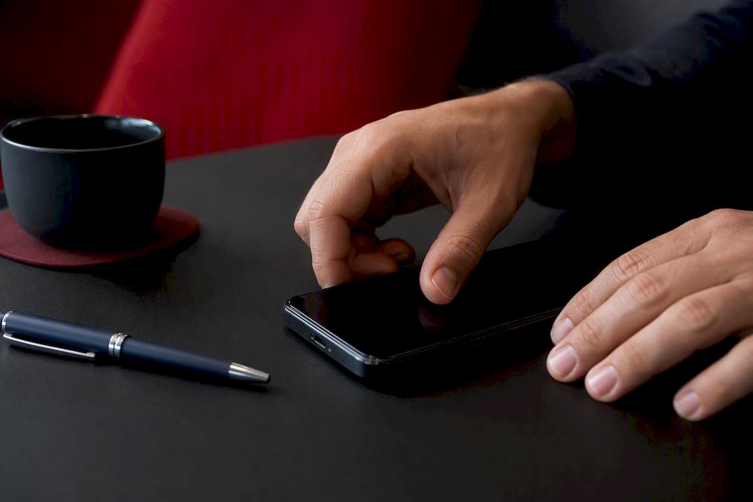 Hands adjusting SaaS user permissions on device