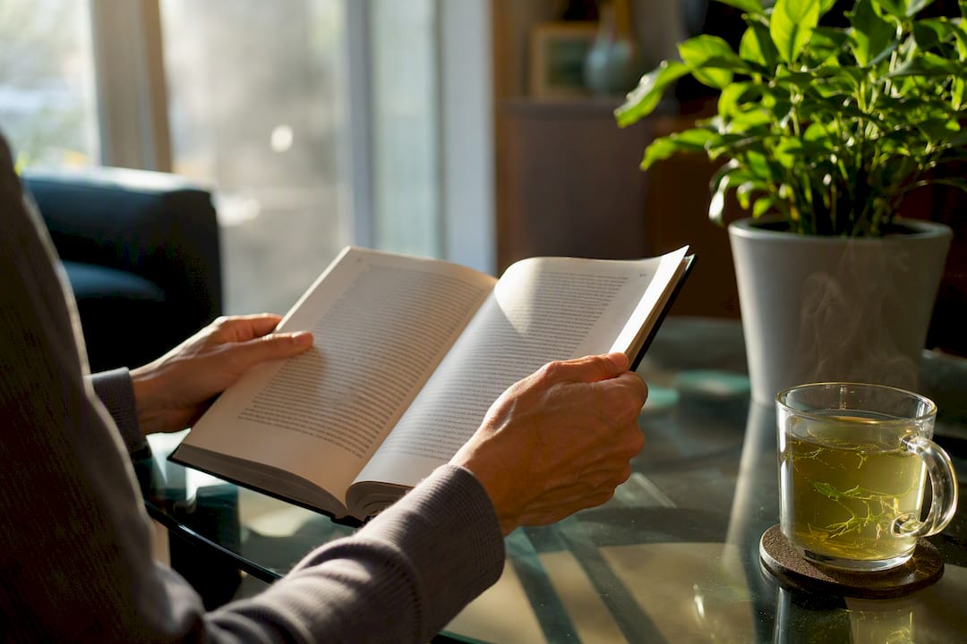 Hands flipping investment book pages