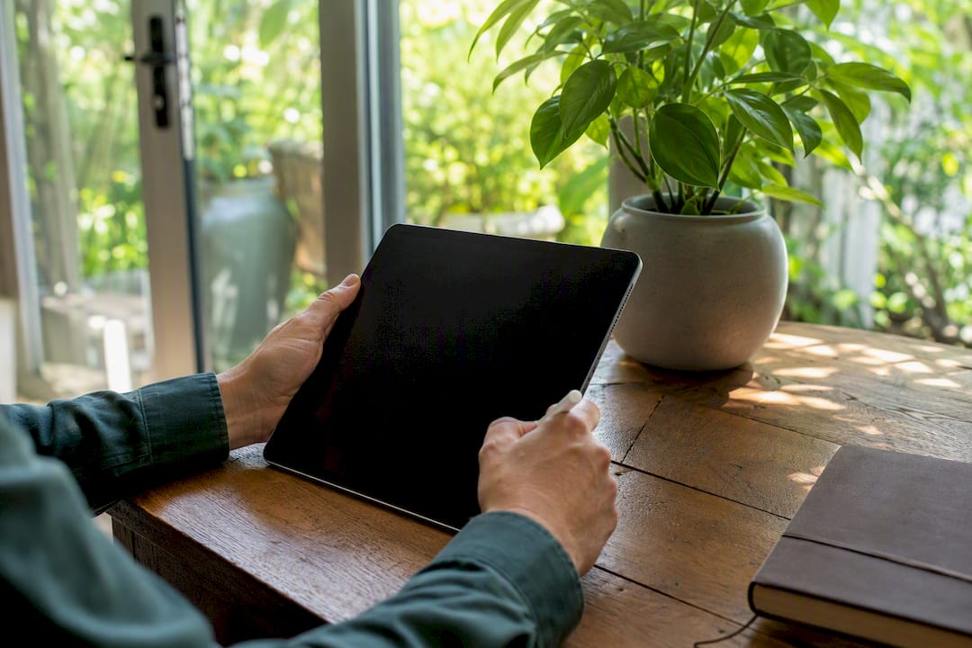 Investor hands with tablet and financial paper