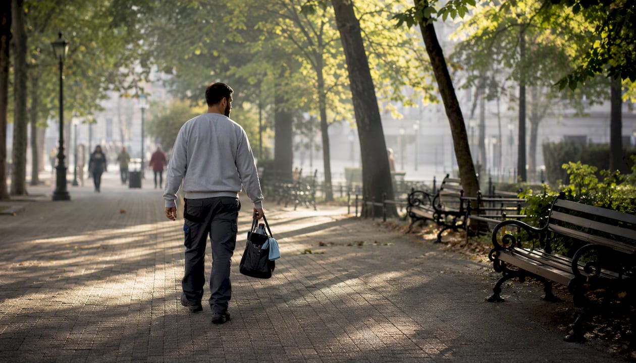 Cleaner walking between two cleaning jobs