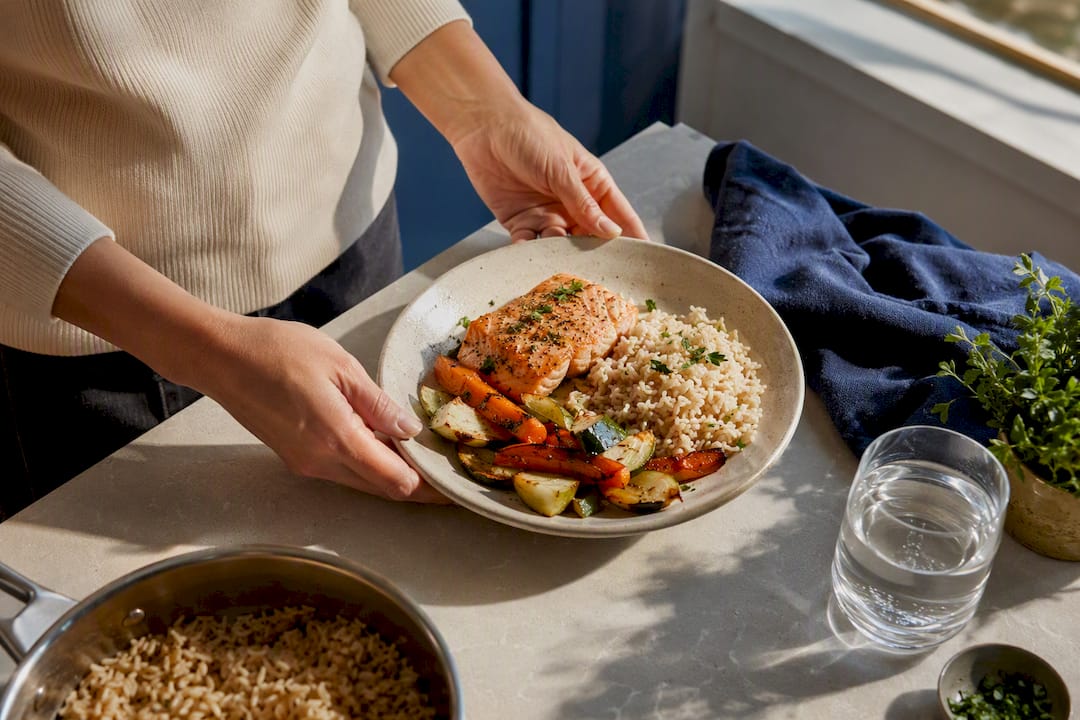 Hands plating a simple mindful Sunday meal