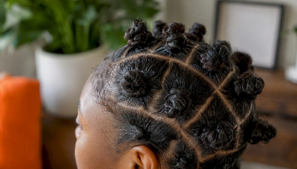 Close-up of 4B hair styled in Bantu knots