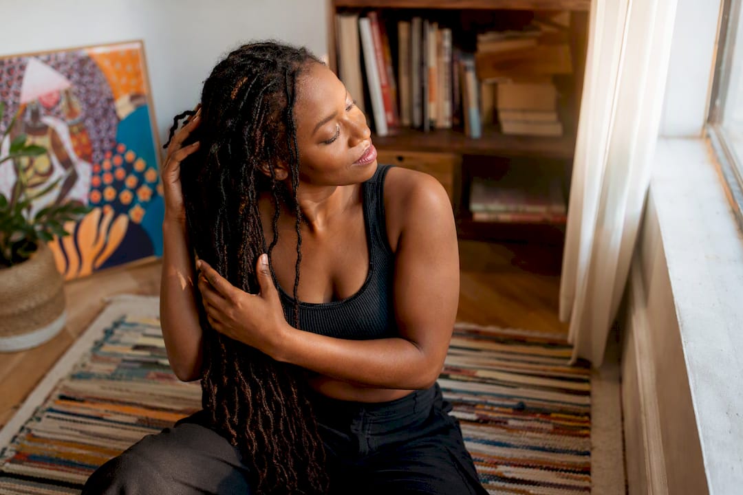Woman connecting with mature locs indoors