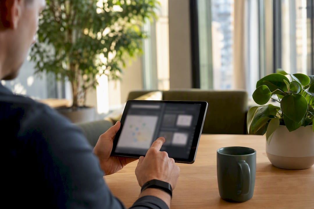 Hands pointing at tablet during competitor source mapping