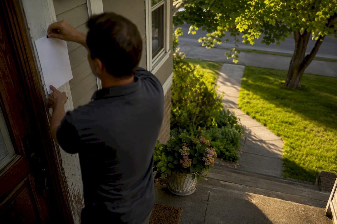 Notice being posted on rental door
