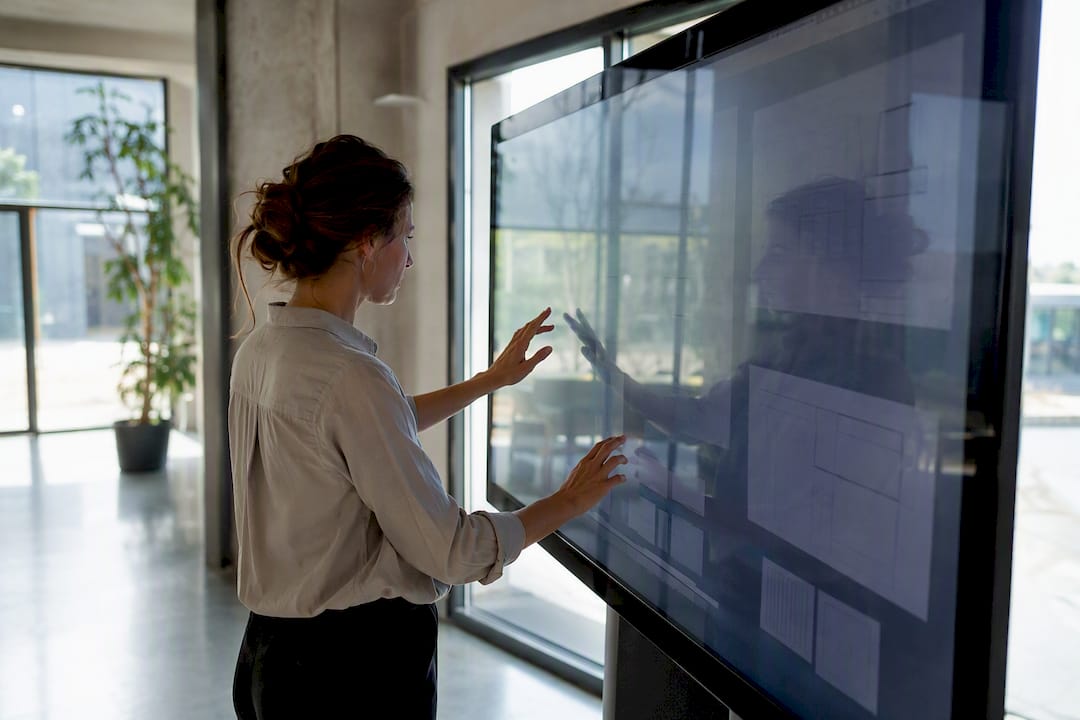 Hands organizing data tags on board